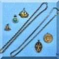 J16. Gold necklaces and charms. 